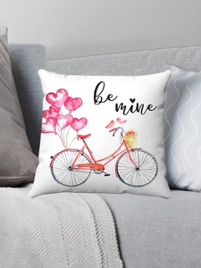 Detail of flamingo themed plush pillow case with heart balloons and be mine text on sofa