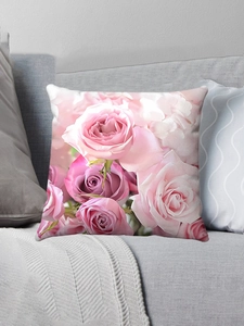 Detailed close-up of pink and purple rose floral print on square plush pillow cover