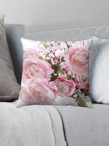 Detail of pink rose plush pillowcase on a gray sofa for holiday home decoration