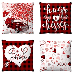 Detail view of four-piece Valentine's Day plush pillow covers with heart and truck motifs