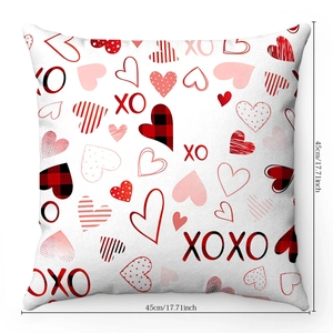 Detail of 45cm square pillowcase with red heart patterns and XO print for Valentine's