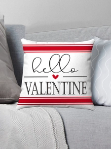 Detail of red and white striped Valentine pillow with Hello Valentine print on grey sofa