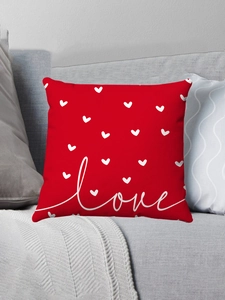 Detail shot of a red short plush Valentine pillow case with white heart and love print
