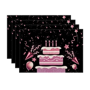 Set of 4 birthday place mats with pink glittery cake and balloon patterns on black
