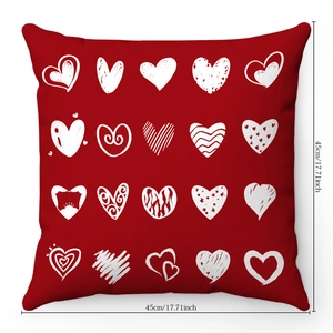 Detail of red plush pillow case featuring 20 white decorative hearts in 45cm x 45cm size
