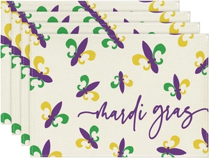 Close-up of Mardi Gras themed dining mats with fleur-de-lis prints and fabric texture