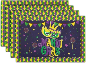 Detail of four stacked Mardi Gras placemats with festive crown and mask print