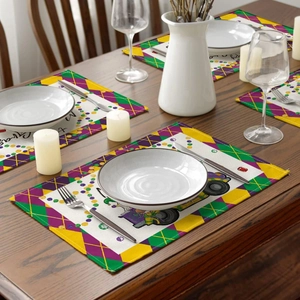 Detail of Mardi Gras placemat with purple green gold diamonds and carnival mask print