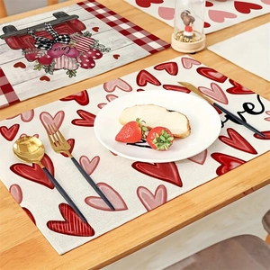 Valentine placemats with retro car and heart patterns on a wooden table with tableware