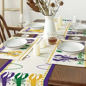 Mardi Gras table runner and placemat set with colorful lobster print on wooden table