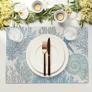 Detail of coral and starfish pattern on blue ocean themed table runner for dining decor