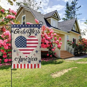 Close-up of linen garden flag texture featuring God Bless America heart design