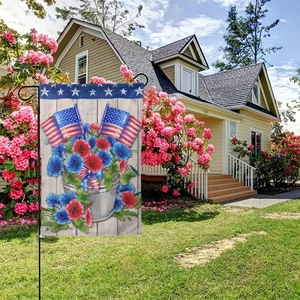 Outdoor American Independence Day garden flag with floral patterns on a sunny lawn
