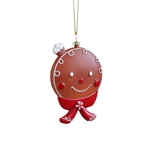 Classic gingerbread man Christmas tree ornament with red bow and gold hanging string