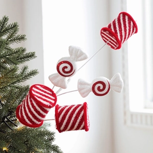 Glittery red and white candy cane tree picks for festive Christmas floral decoration