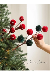 Detail of Christmas candy lollipop branch with red and green flocked berries decor