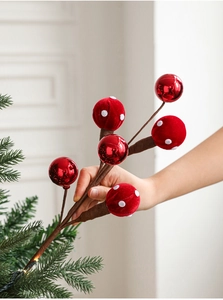 Detail of red foam ball candy sprays for Christmas tree and festive wreath decoration