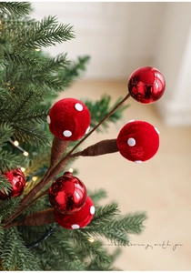 Close-up of red candy-shaped foam balls and mushroom stems for Christmas tree decor