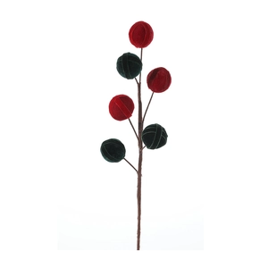 Christmas tree branch decoration with red and green velvet balls and ribbon details