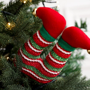 Christmas elf legs decor with red green stripes and bells for holiday tree styling