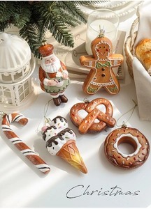 Flat lay of gingerbread man and holiday ornaments with cozy winter shadows