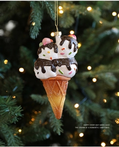 Close-up of ice cream cone Christmas tree ornament with glitter and golden string