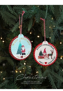 Close-up of wooden Christmas countdown ornament hanging on tree with festive lights