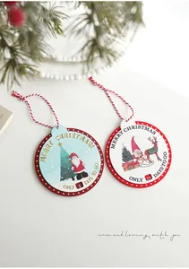 Detail of wooden Christmas countdown hanging decor with Santa and reindeer illustrations