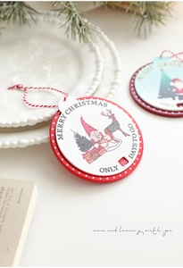 Close-up of wooden Christmas countdown plaque featuring Santa, reindeer and tree illustrations