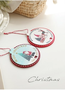 Detail of wooden Christmas countdown plaques featuring Santa and reindeer with red polka dots