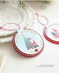 Detail of wooden Christmas countdown ornament with Santa Claus illustration and festive rope
