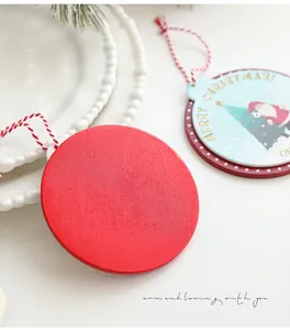 Macro shot of wooden Christmas countdown hanging tags with Santa and tree motifs