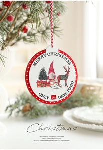 Close-up of wooden Christmas countdown plaque with gnome and reindeer illustration