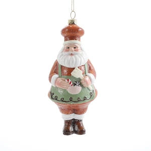 Christmas Santa chef ornament in red coat with green apron holding a pink candy bowl