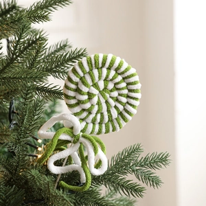 Christmas foam candy cane ornament with green and white swirls on a festive tree