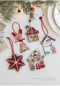 Detailed set of red wooden Christmas ornaments featuring snowflakes, skis and gingerbread houses