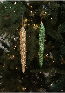 Detail view of glittery 21cm gold and green spiral icicle ornaments on a Christmas tree