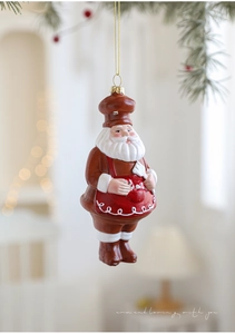Décoration de Noël Père Noël chef suspendu à un sapin avec lumières festives