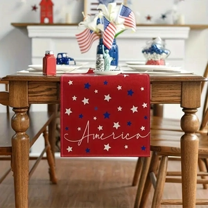 Detailed texture of red American Independence Day table runner with white star prints