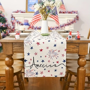 Close-up of 4th of July linen table runner with red and blue stars on a wooden table