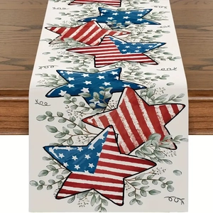 Detail of American Independence Day linen table runner with stars and eucalyptus on wood
