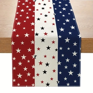Close-up of linen table runner with red white and blue stripes and star patterns