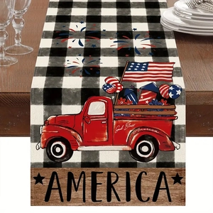 Detail of Independence Day linen table runner with red truck and flag on wooden table