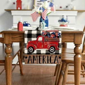Detail of linen table runner featuring red truck, stars, and patriotic America print