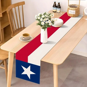 Detail of Texas flag table runner with red white stripes and star on wooden table