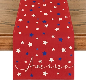 Detail of linen table runner with red fabric, blue stars, and America script