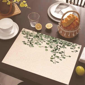 Detail of tropical green leaf placemat with woven texture on dark wooden dining table
