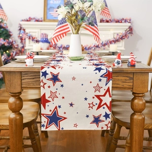 Detail of linen table runner with red blue stars for 4th of July festive dining decor