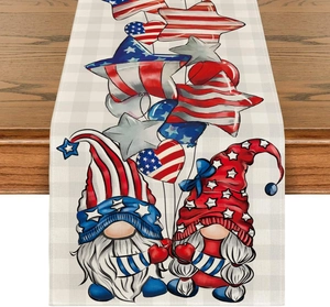 Detail of linen table runner with Independence Day gnome print on a dark wooden table