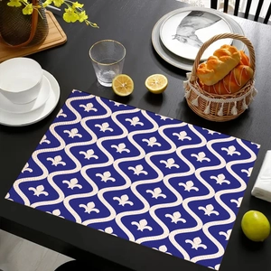 Detail view of a navy blue bohemian placemat with white fleur-de-lis pattern and waves